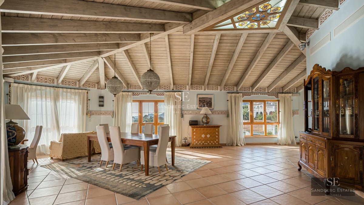 Exterior view of a modern villa with pool, garden, and large windows. Contemporary architecture featuring clean lines and open spaces.