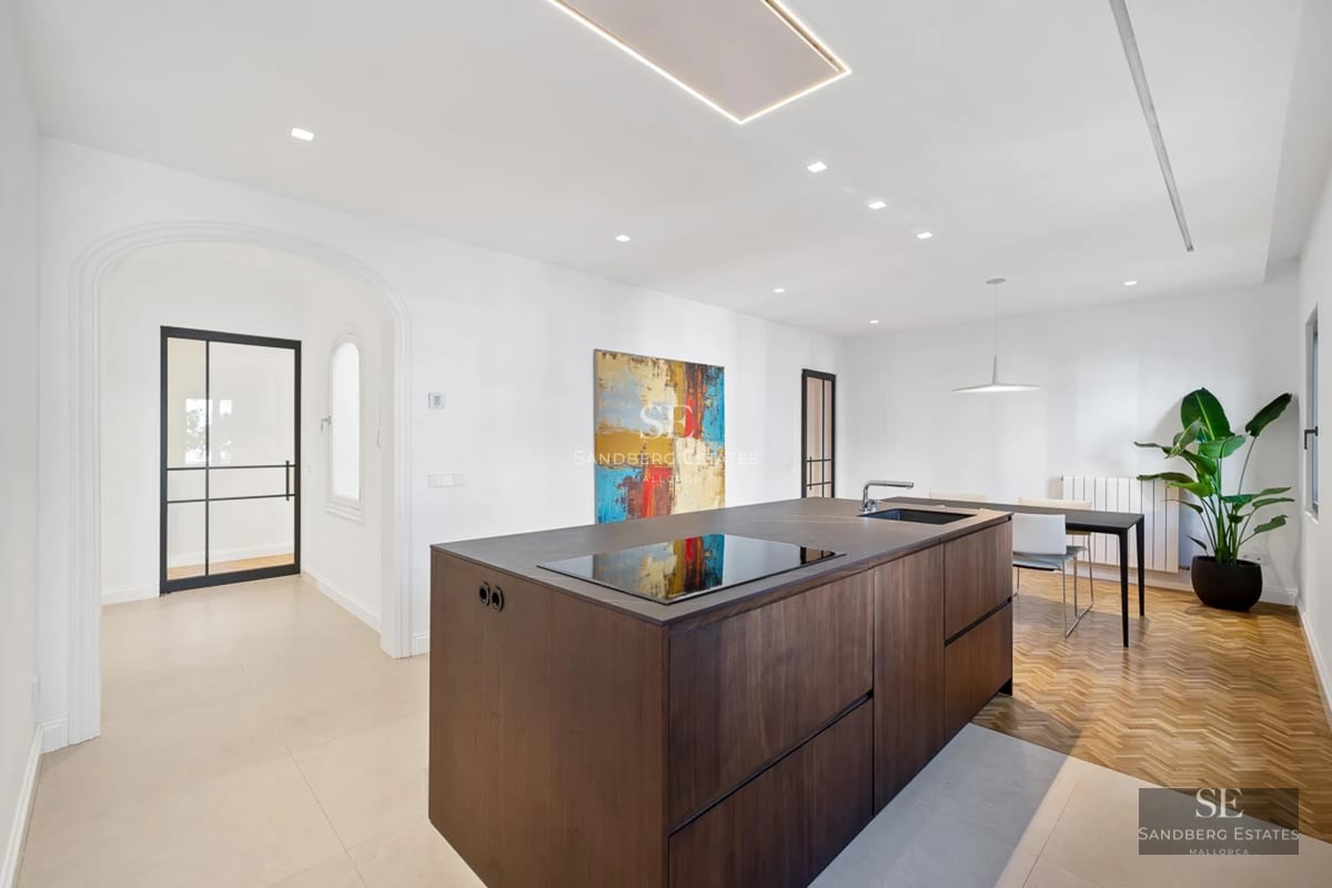 Exterior view of a modern villa with reflecting pool, surrounded by gardens and minimalist architecture. Warm lighting and sleek design.