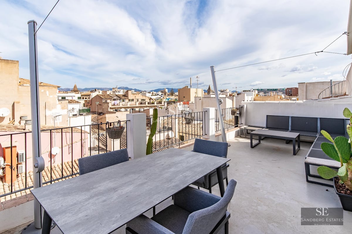View of a modern villa featuring a swimming pool, sun deck, and lush garden. Minimalist design with high-quality finishes.