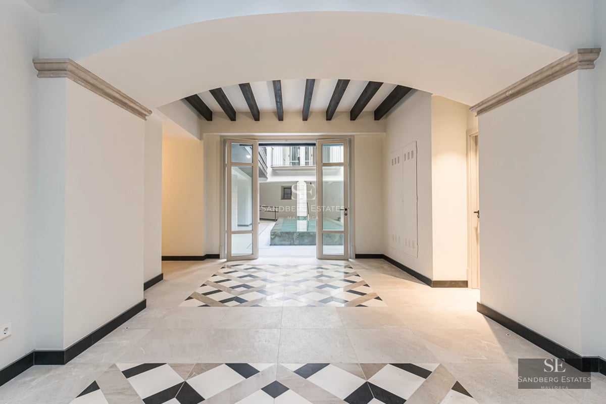 View of a modern villa with a pool, surrounded by greenery. Sleek design, high-quality finishes, and abundant natural light.