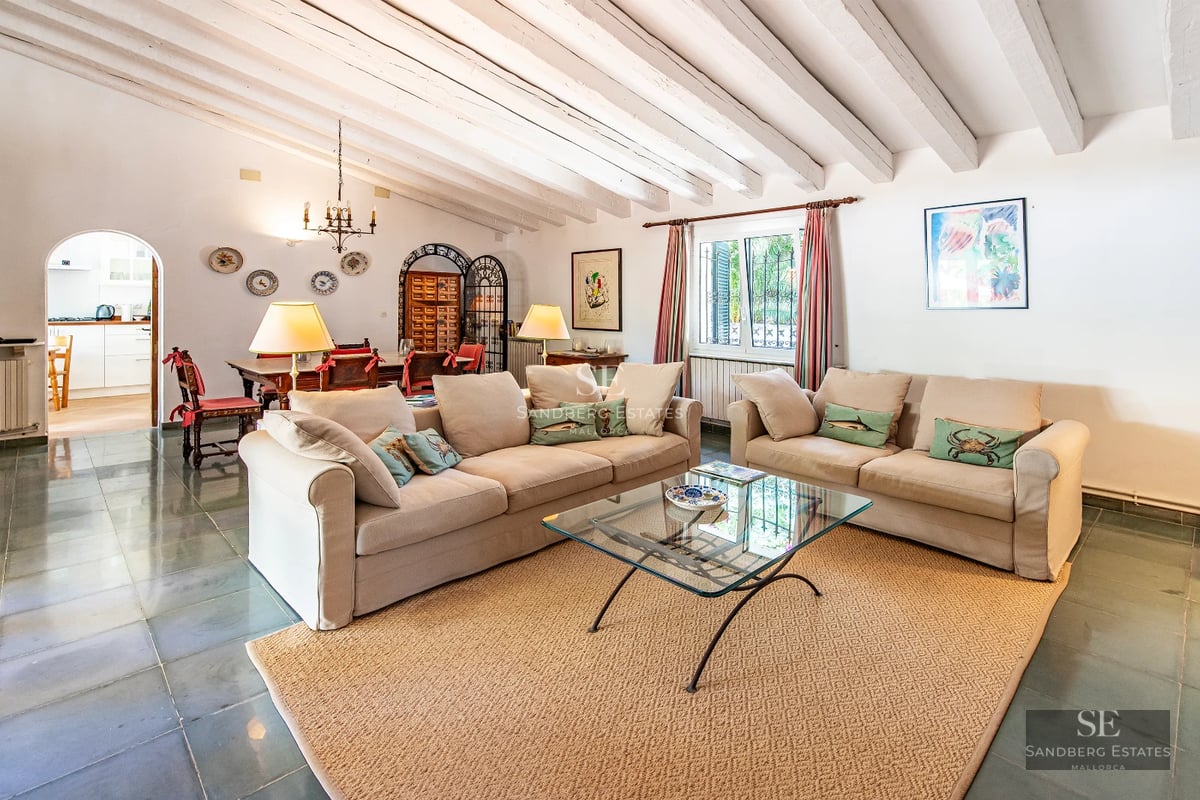 View of infinity pool and terrace with modern furniture. Minimalist architecture, large windows, and unobstructed views.