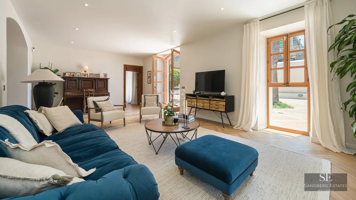 Modern villa exterior featuring a pool. Minimalist design, large windows, and manicured landscaping. Warm ambient lighting.