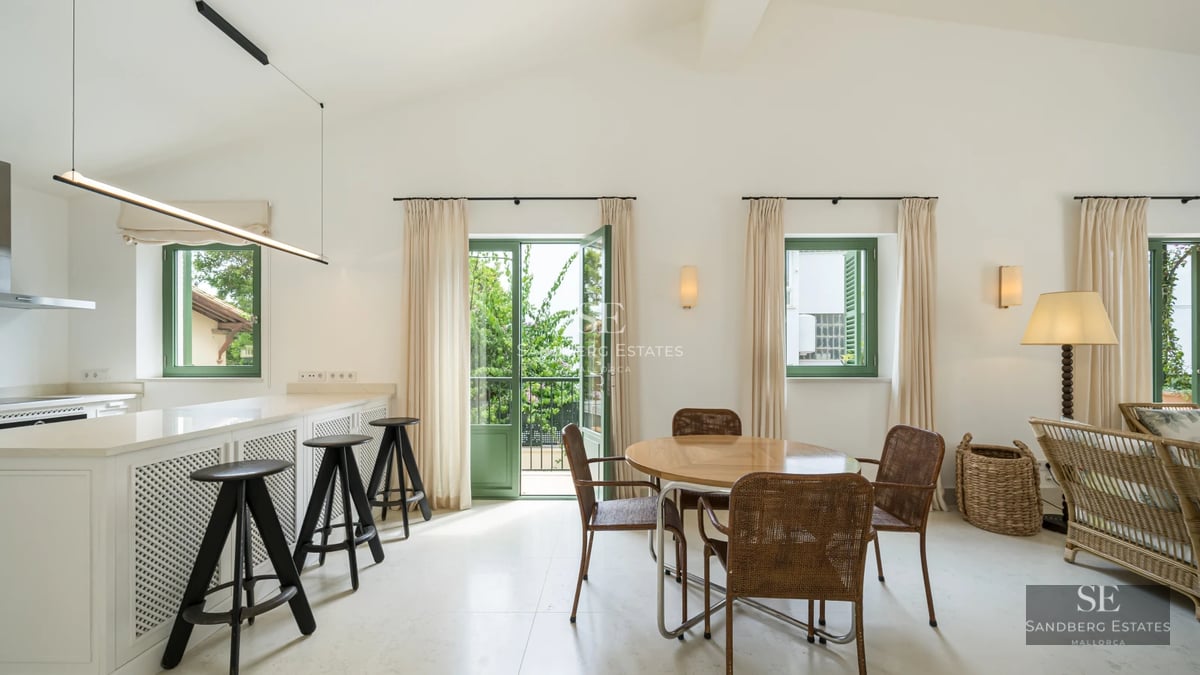 Spacious balcony with ocean view. Wooden floors, glass railing. Modern and elegant design. Soft ambient lighting.