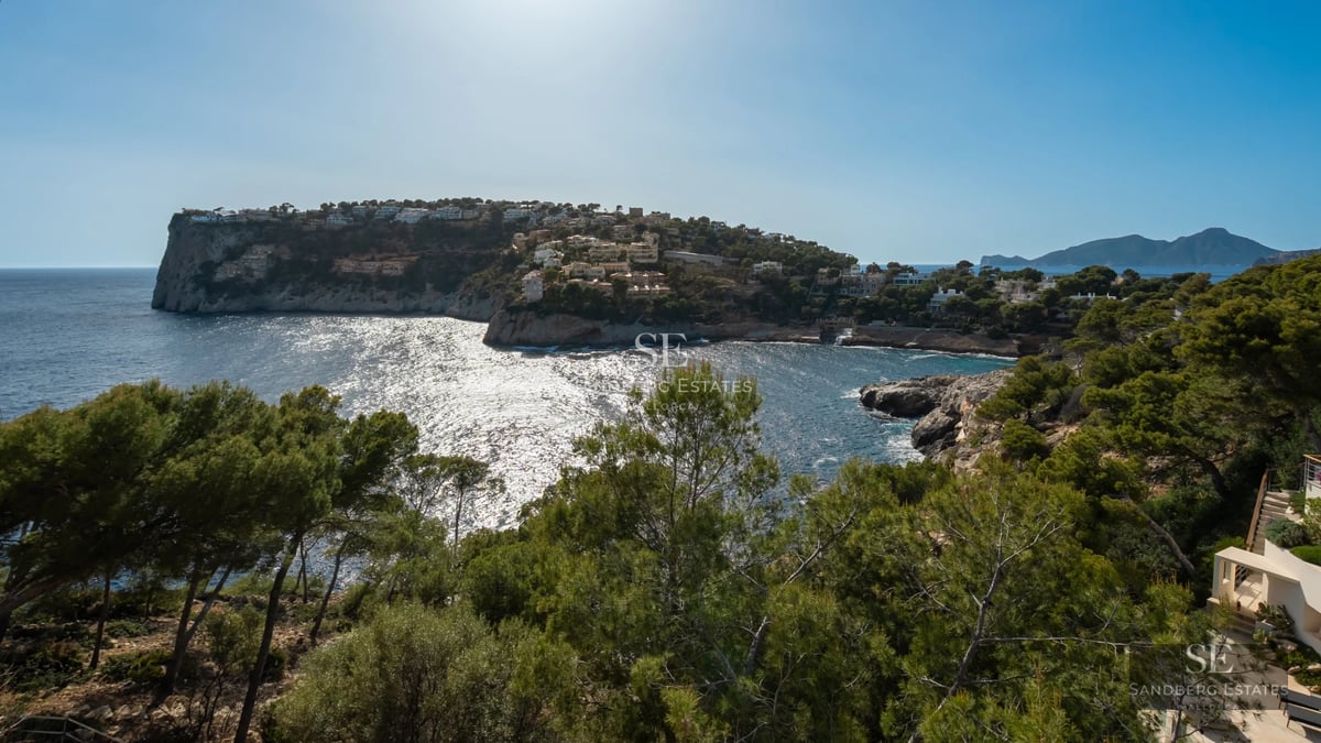 Spacious terrace featuring an infinity pool and panoramic views. Modern architecture with clean lines and abundant natural light.