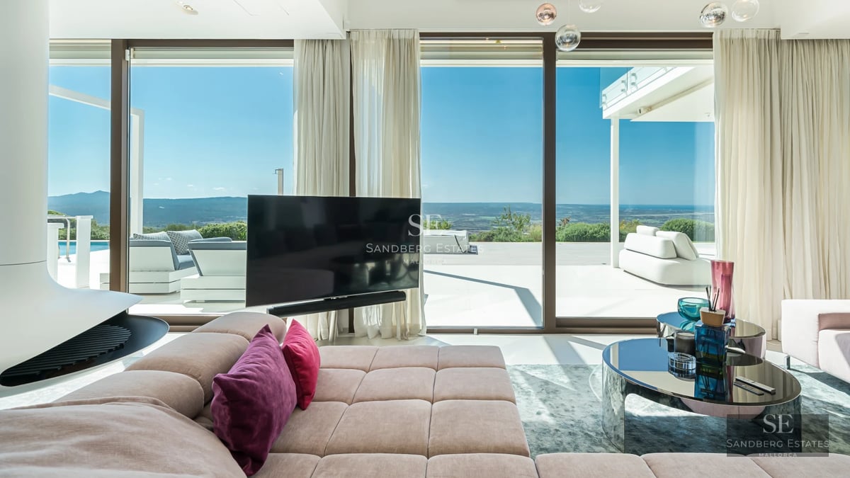 Spacious terrace with infinity pool, sun loungers, and panoramic views. Modern, elegant, and minimalist design. High-quality outdoor furniture.