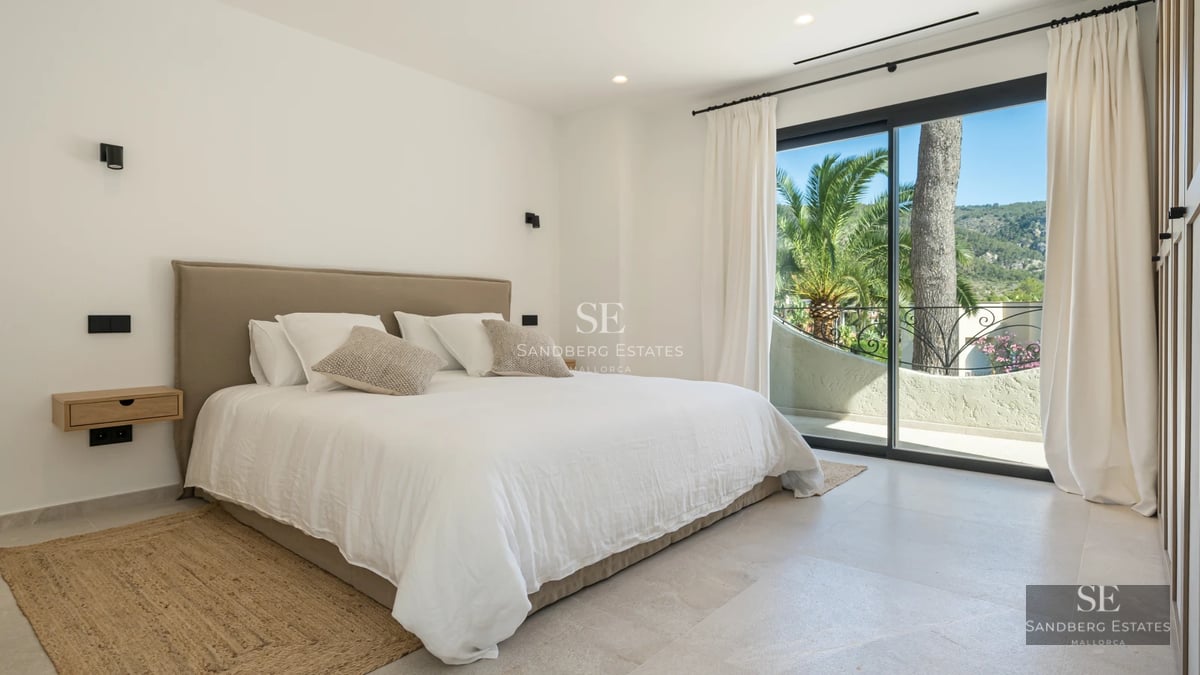 Exterior view of a modern villa with a pool, manicured garden, and large windows. Minimalist and elegant architecture.