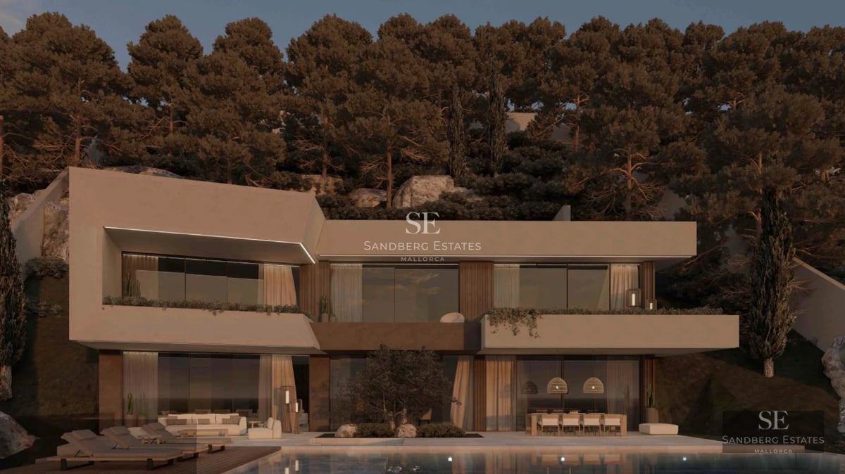 Spacious balcony overlooking the sea, modern outdoor furniture, glass railing and wooden flooring.