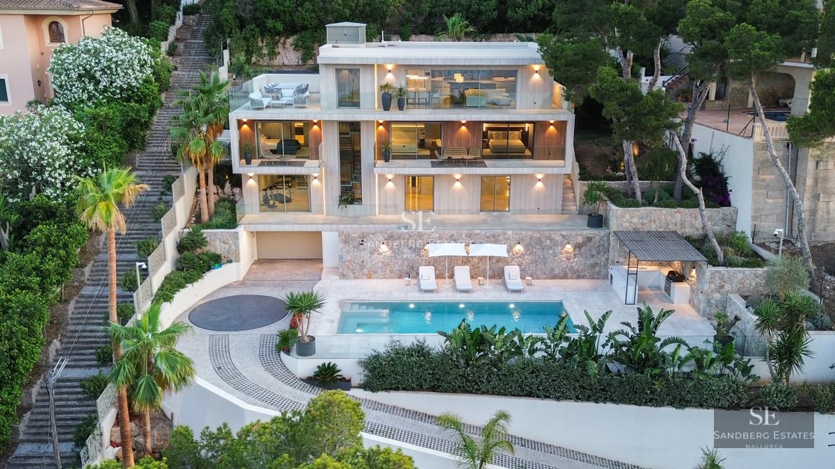 Exterior view of a modern house with pool, lush garden, and minimalist design. Natural lighting and large windows.