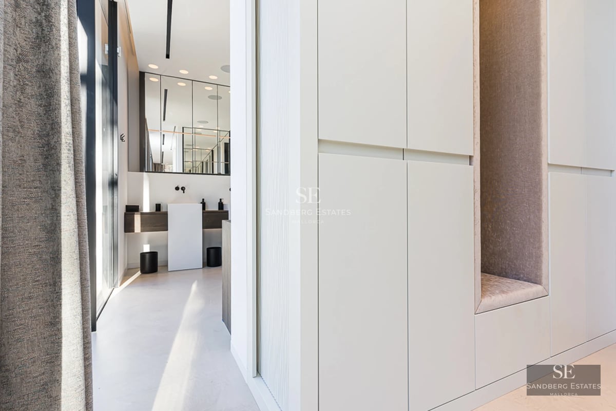 Bright interior. Window wall with sea view, modern sofa, coffee table and minimalist decor. Elegance and comfort define this space.