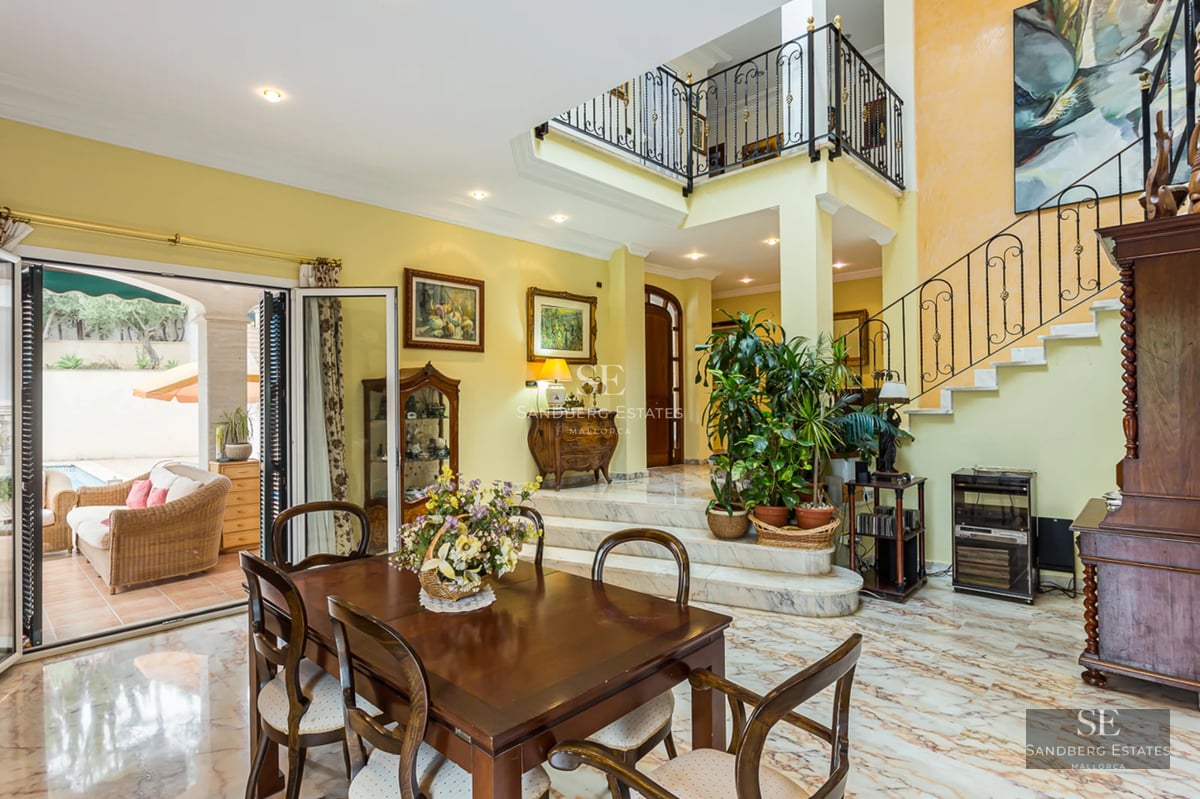 Exterior view of a modern villa featuring a pool, large garden, and minimalist architectural design. Warm lighting and sophisticated ambiance.