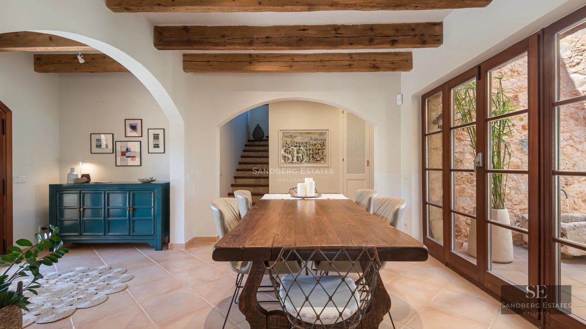 Spacious balcony with panoramic sea views. Modern design, glass railing, tiled floor, and stylish outdoor furniture.