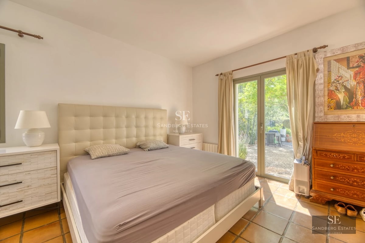 Exterior view of a modern villa with a pool. Minimalist design, large windows, terrace, and manicured landscaping.