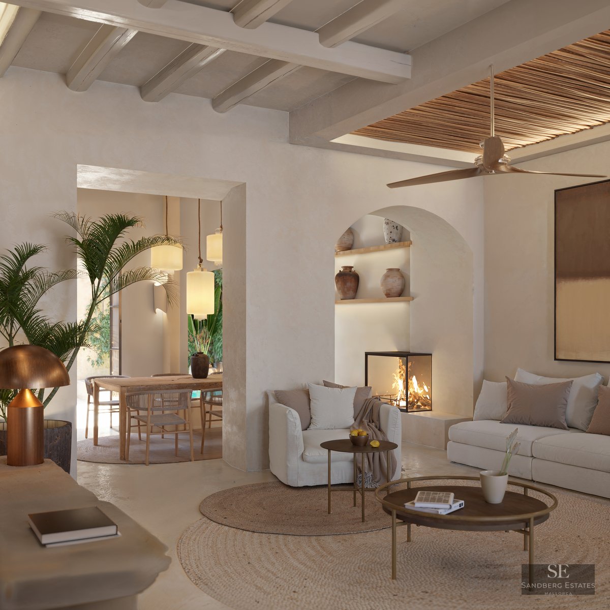 Elegant living room with white sofas, wooden beams, a glass fireplace, and an arched niche with decorative vases.