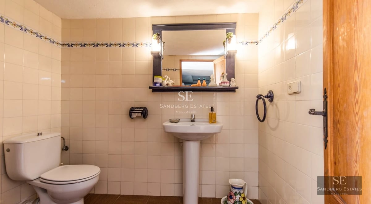 Spacious terrace featuring a swimming pool, sun loungers, and garden view. Modern design with natural lighting and luxurious finishes.