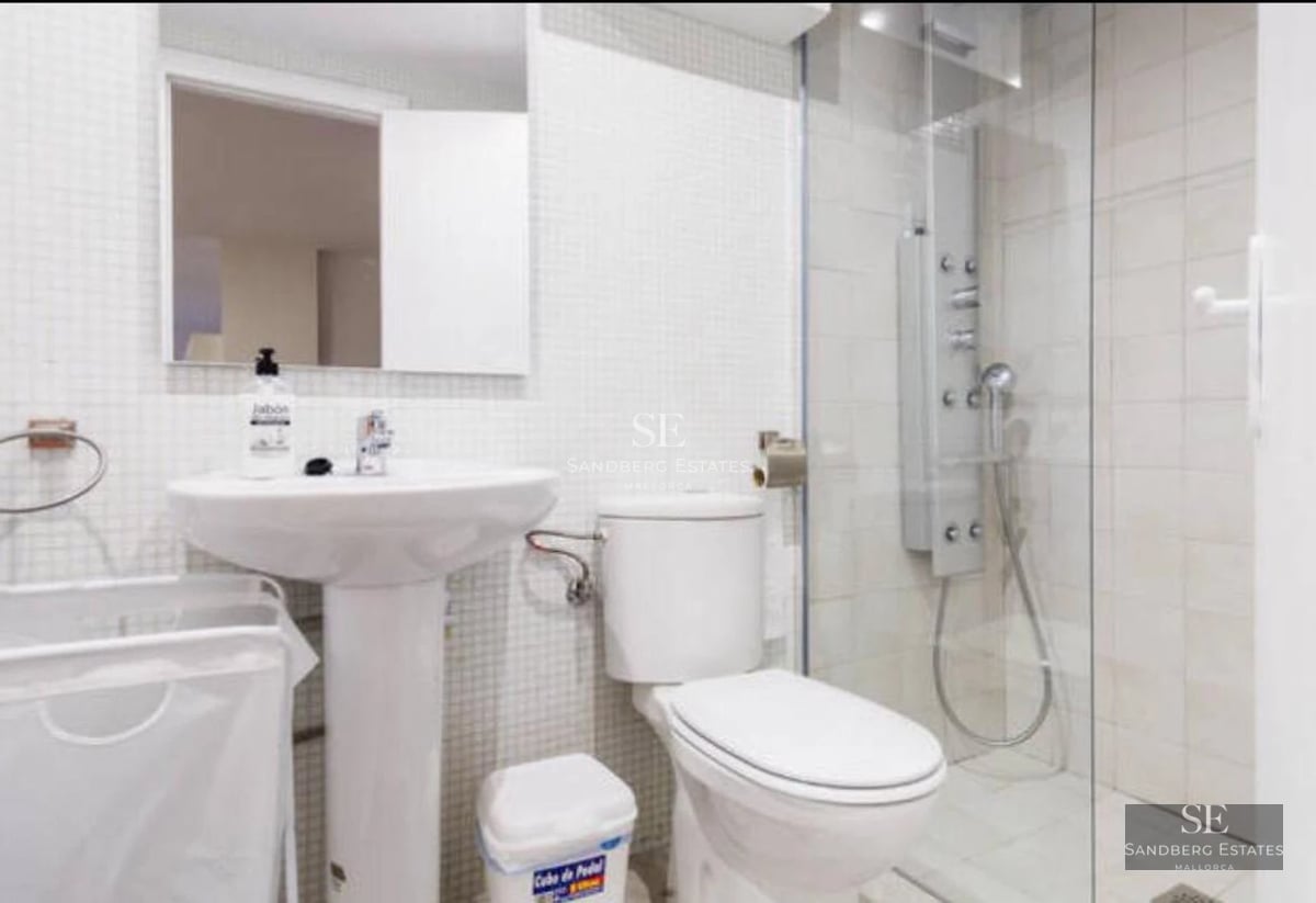 Exterior view of a modern luxury home with reflecting pool. Minimalist design featuring large windows and lush gardens.