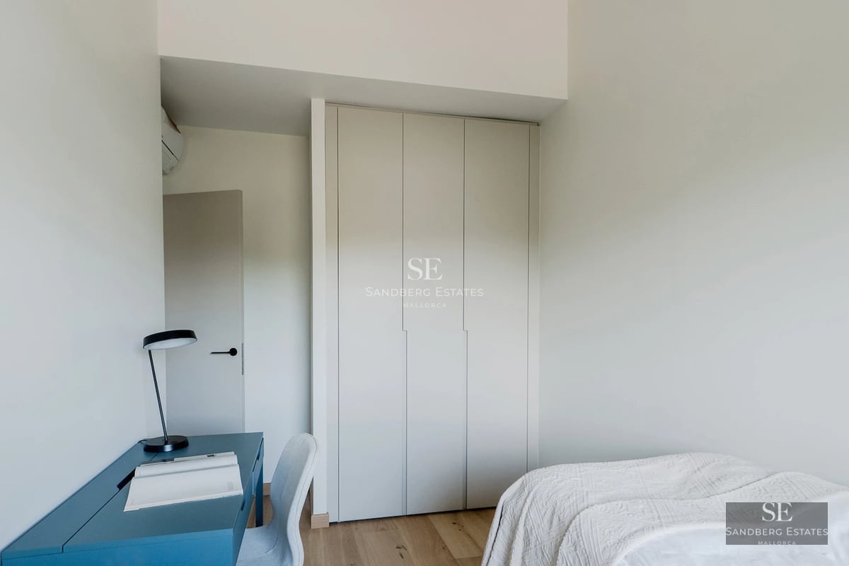 Expansive terrace featuring an infinity pool, sun loungers, and panoramic sea views. Modern and minimalist design.