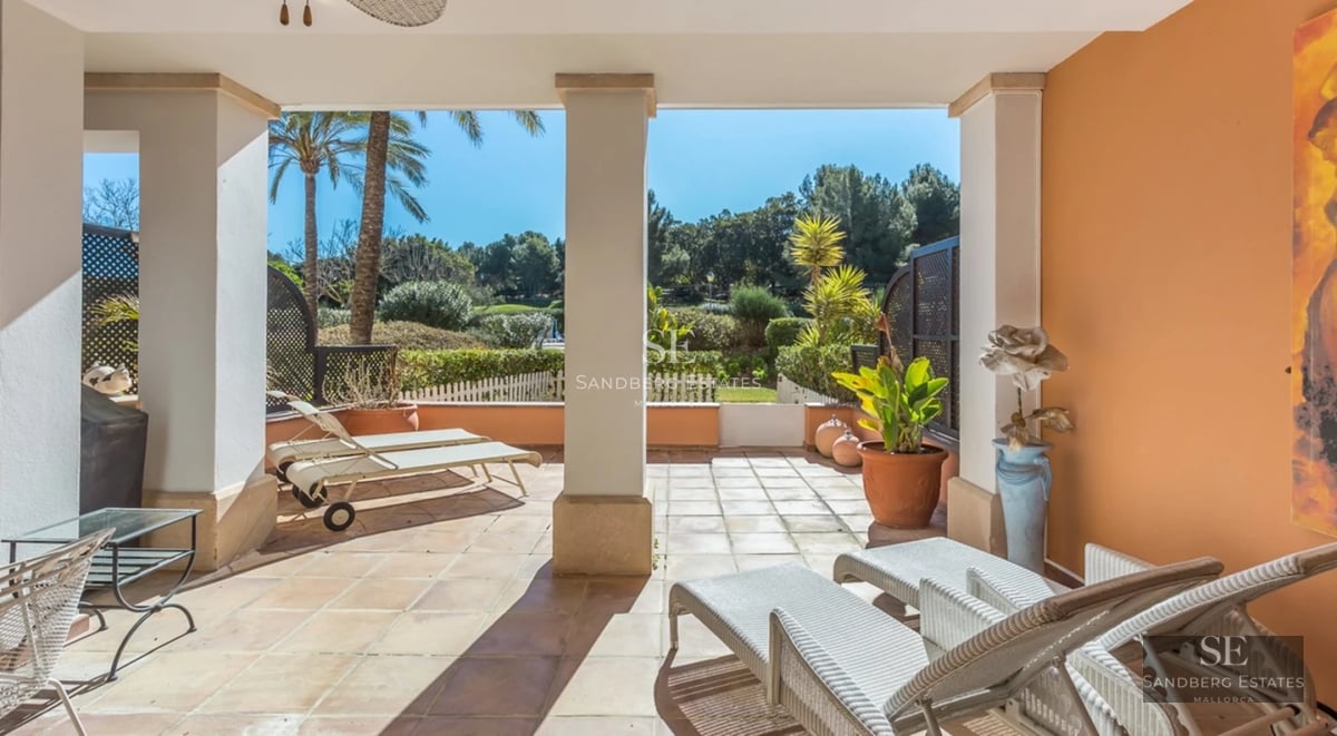 Exterior view of a modern villa featuring a swimming pool, lush garden, and minimalist architecture. Natural lighting and sleek design.