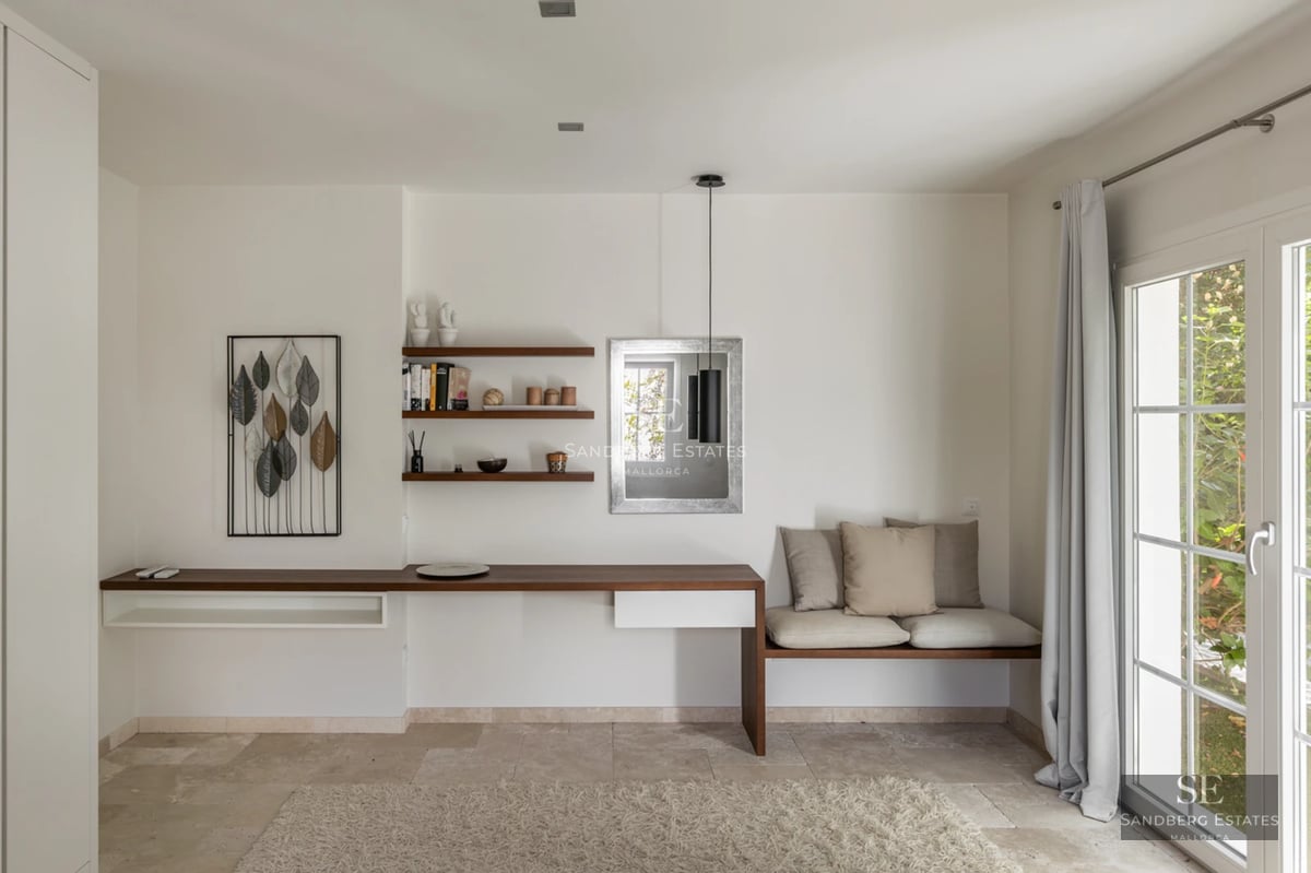 Exterior view of a modern villa featuring a pool, lush garden, and minimalist architecture. Natural lighting and high-quality finishes.