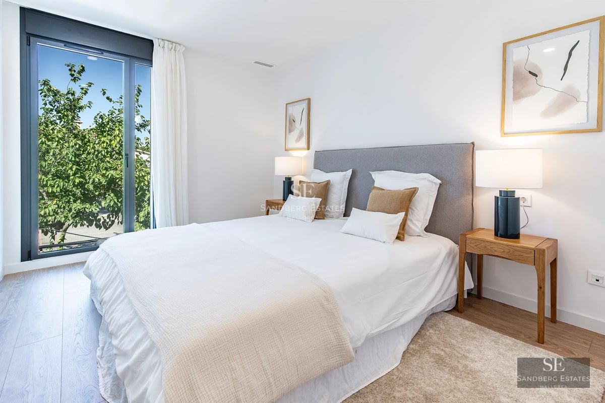 View of the villa with infinity pool, gardens, ambient lighting, and modern architecture. Spacious areas and elegant design.