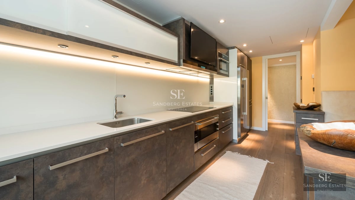 Exterior view of a modern villa featuring a swimming pool, garden, and large windows. Minimalist architecture with high-quality finishes.