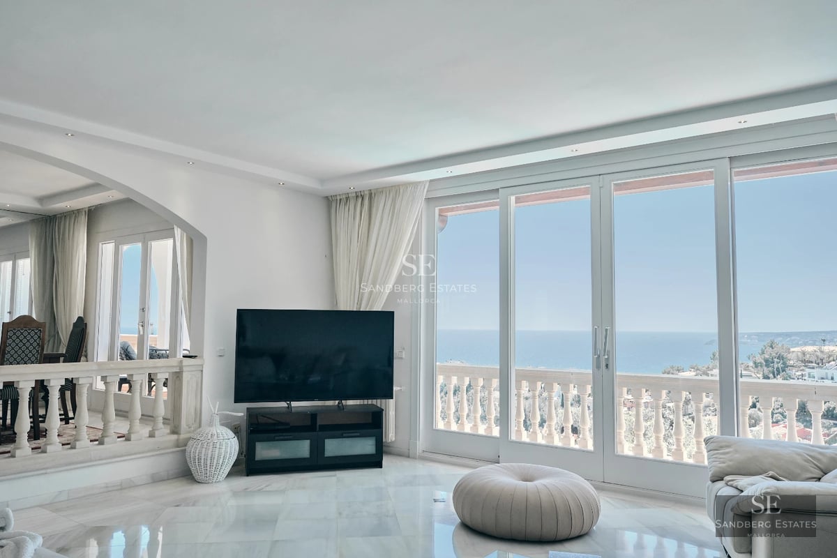 Pool view with infinity edge, sun deck with loungers, lush garden. Modern architecture and panoramic views.