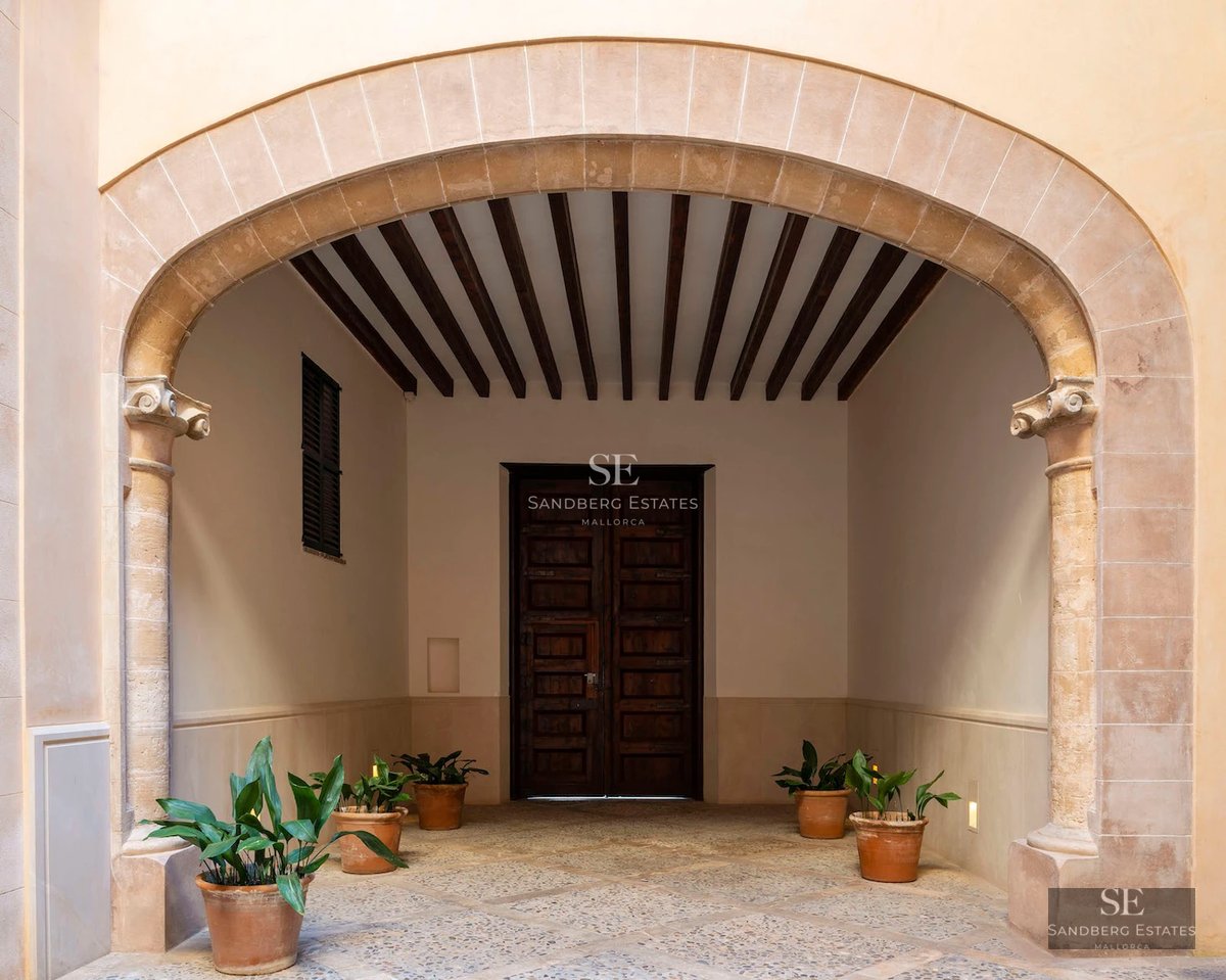 Pool view of modern villa with terrace, lounge chairs, and garden. Contemporary architecture, natural light.