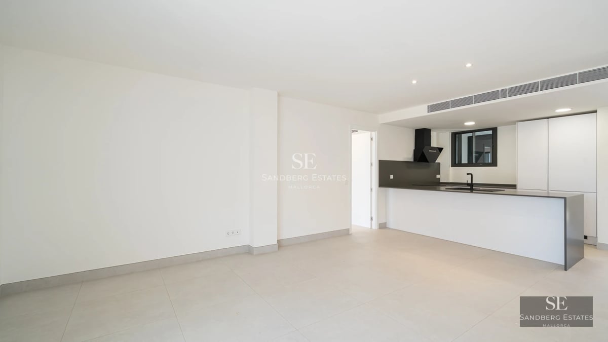 Bright, spacious living room with balcony, sea view. Modern design, neutral color palette, high-quality finishes.