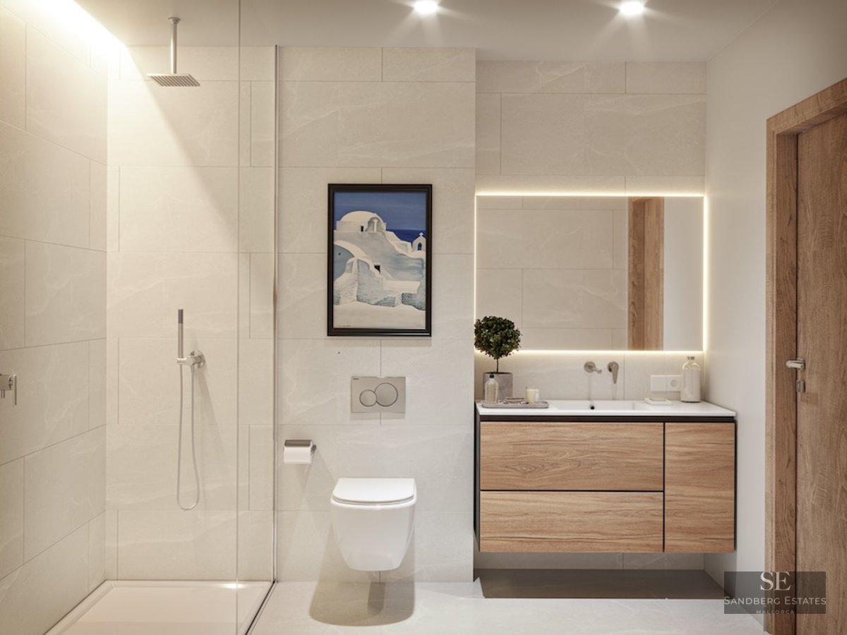 Modern bathroom with beige tiles, floating wood vanity, backlit mirror, and glass walk-in shower.