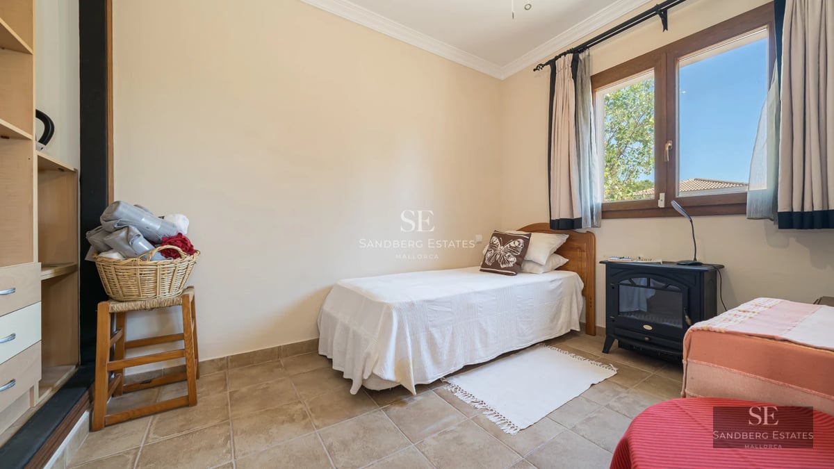 Spacious terrace with infinity pool, modern sun loungers, and panoramic views. Minimalist architecture and manicured landscaping.