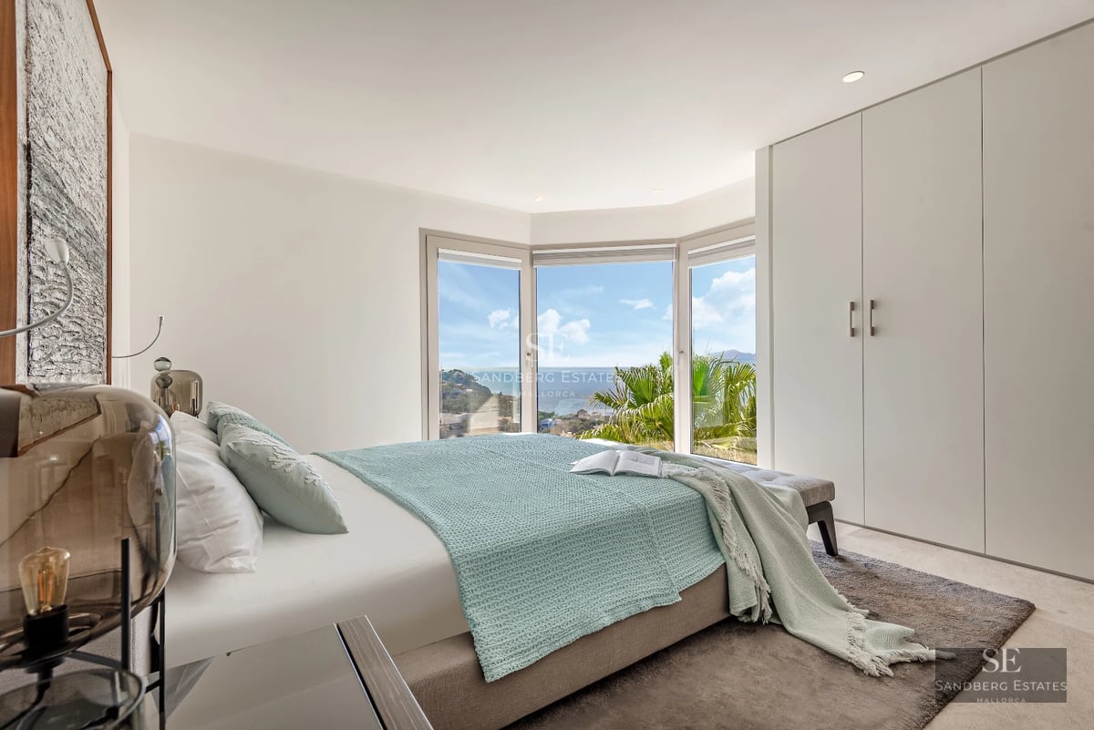 Exterior view of a modern villa with an infinity pool, lush garden, and minimalist architecture. Expansive terraces and natural light.