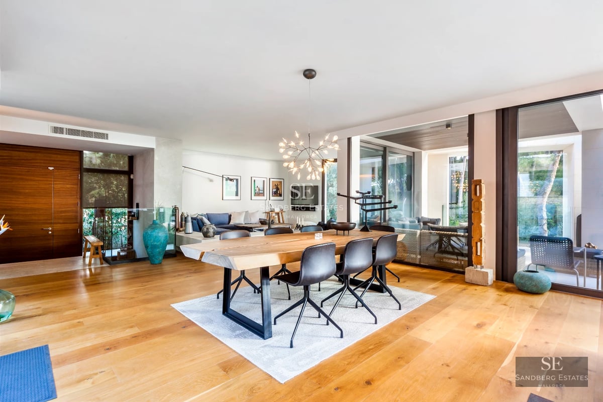 Spacious terrace with infinity pool, modern furniture and panoramic views. Minimalist and elegant design. Natural lighting.