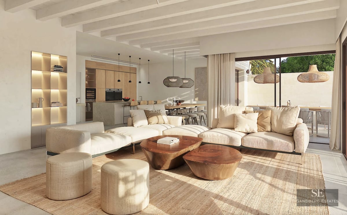 Aerial view of a modern house with infinity pool and large green areas. Minimalist architecture with a predominantly white facade.