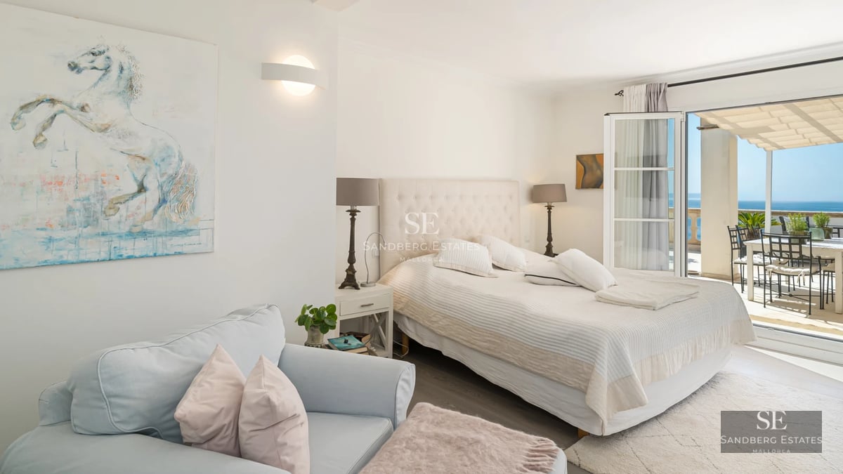 Modern exterior featuring reflecting pool, expansive windows, and manicured garden. Contemporary architecture and lush landscaping.