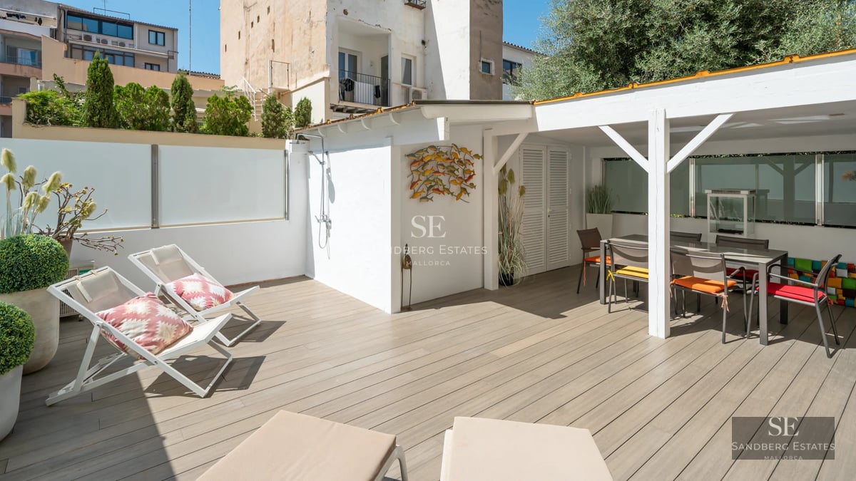 Exterior view of a modern villa with a pool, garden, and large windows offering abundant natural light. Contemporary architectural design.