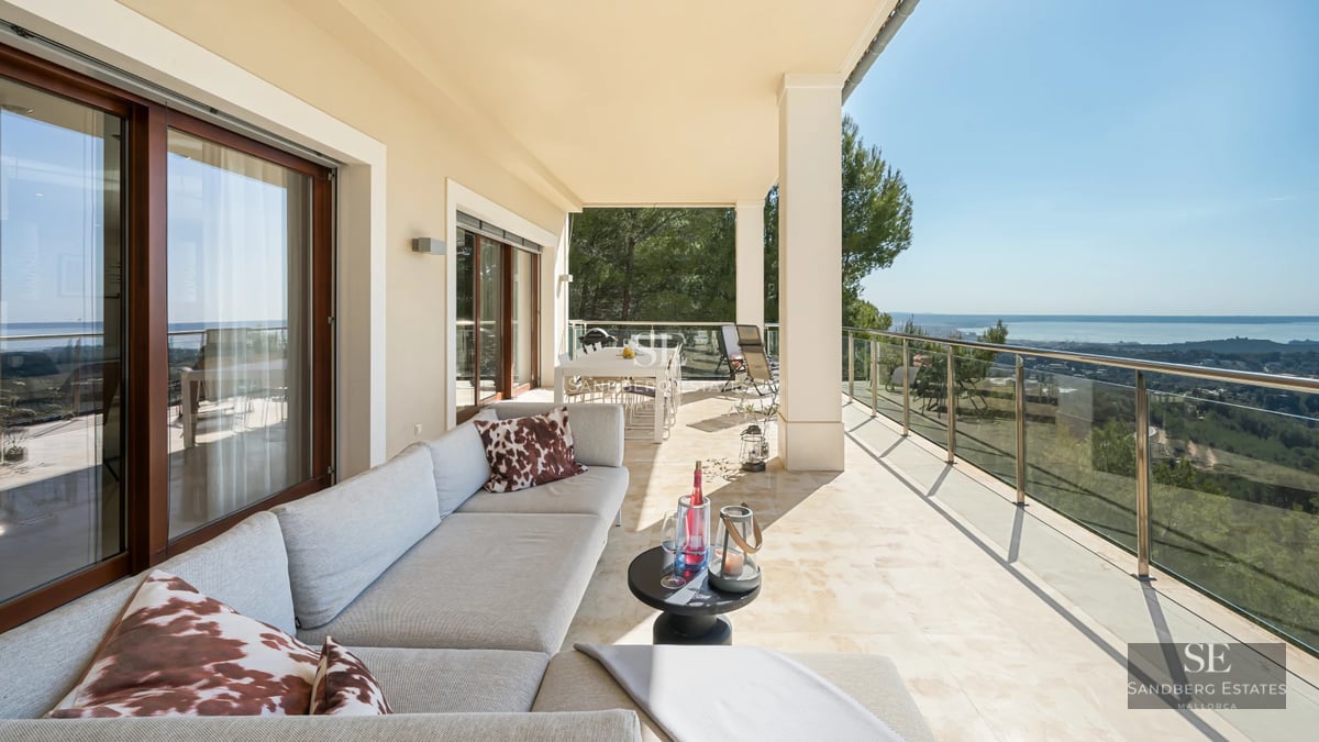 Aerial view of modern villa with infinity pool, lush garden, and spacious terraces. Minimalist and luxurious architectural design.