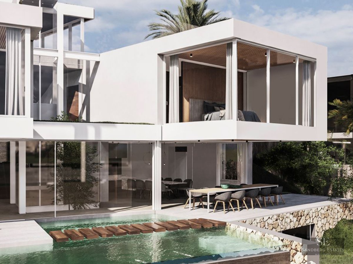 Modern white villa with an infinity pool, wooden stepping stones, and an outdoor dining area under a cantilevered roof.