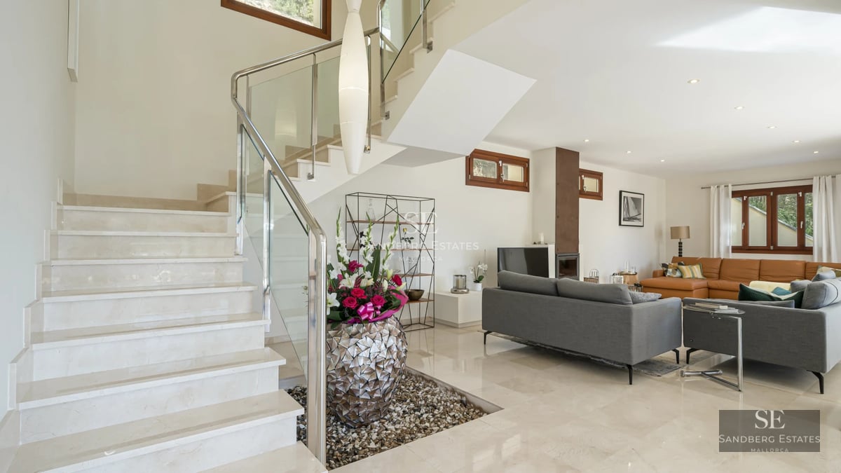 Spacious terrace with infinity pool, sun loungers, and panoramic sea views. Modern design with high-quality materials.