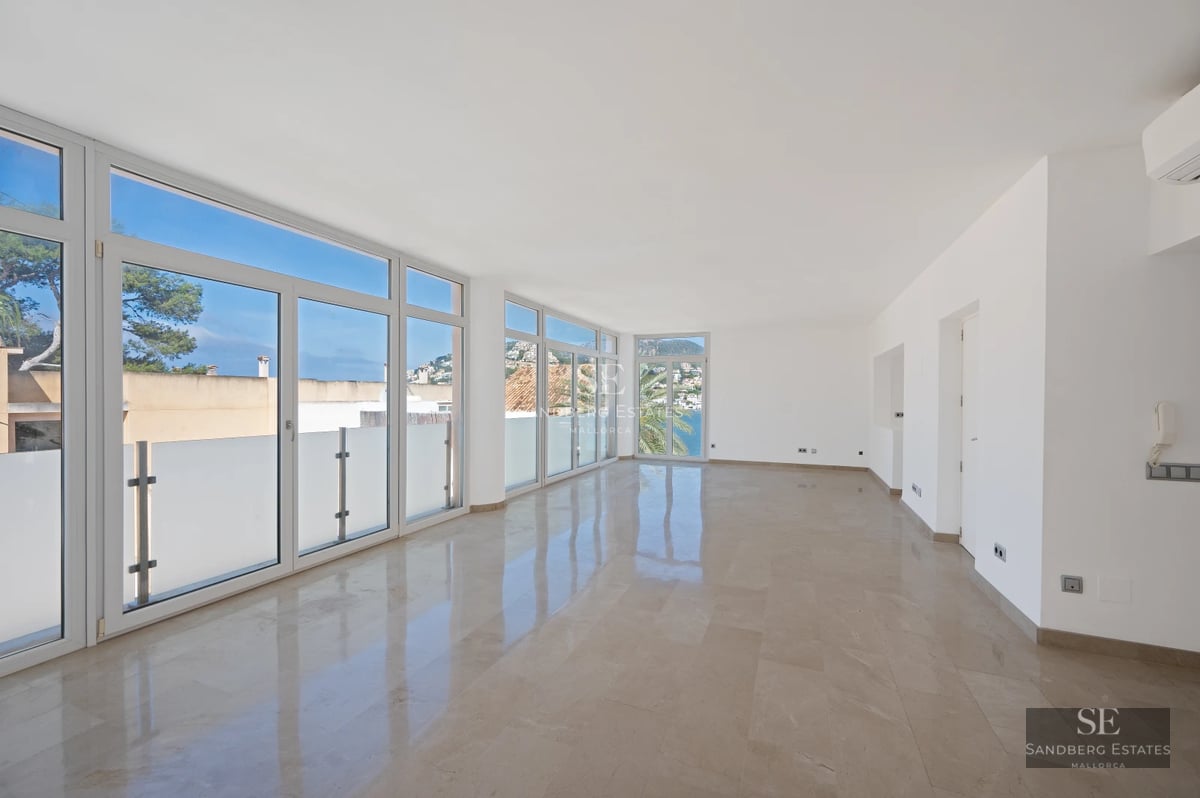 Aerial view of modern villa with turquoise pool surrounded by lush garden and minimalist architecture. Expansive terrace.