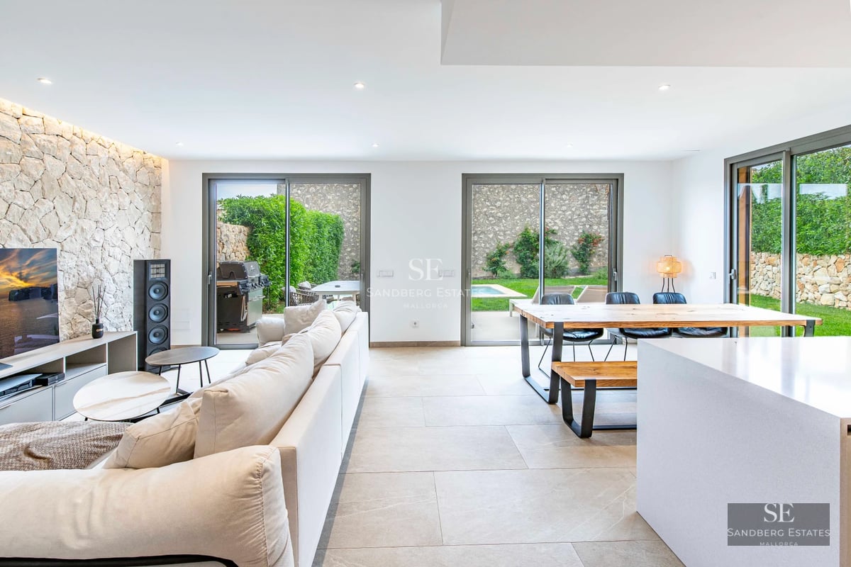 Exterior view of a modern villa featuring a pool, large garden, and minimalist architecture. Sleek and contemporary design.