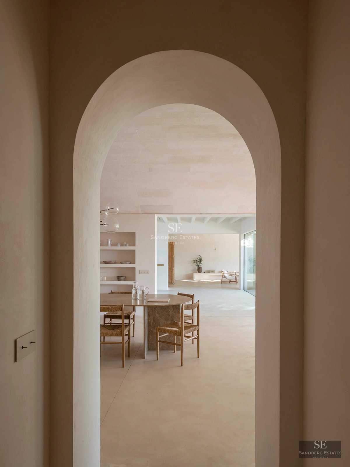 Exterior view of modern home with reflecting pool. Minimalist architecture, large windows, and manicured landscaping.