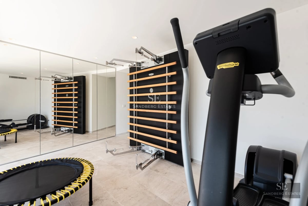 Expansive terrace with pool, sun loungers, and panoramic views. Modern design featuring wood and natural stone elements.