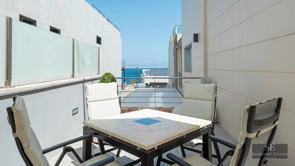 Exterior view of modern villa with infinity pool, expansive terraces, and minimalist design. Luxurious residence with gardens and panoramic views.