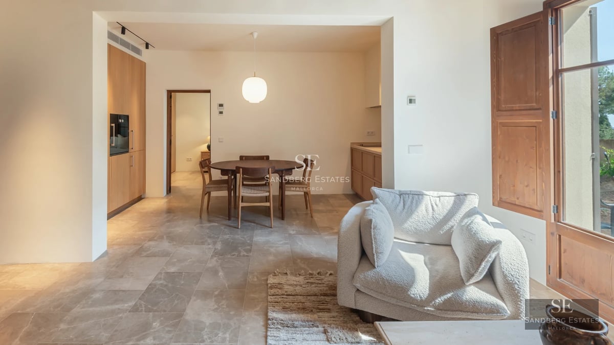 Pool view with lounge chairs and lush garden. Elegant modern design. Natural lighting highlighting the vegetation.
