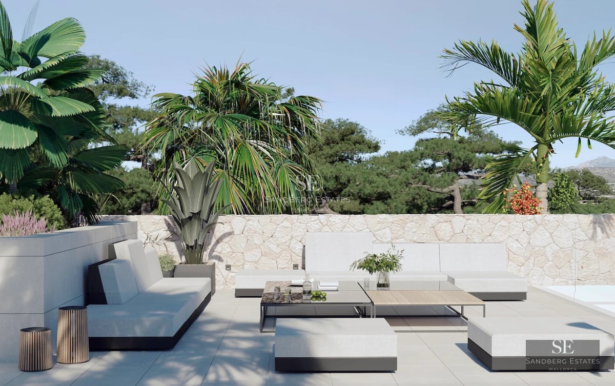 Spacious balcony with sea view. Glass railing, light tile flooring, and modern outdoor furniture. Bright and open space.