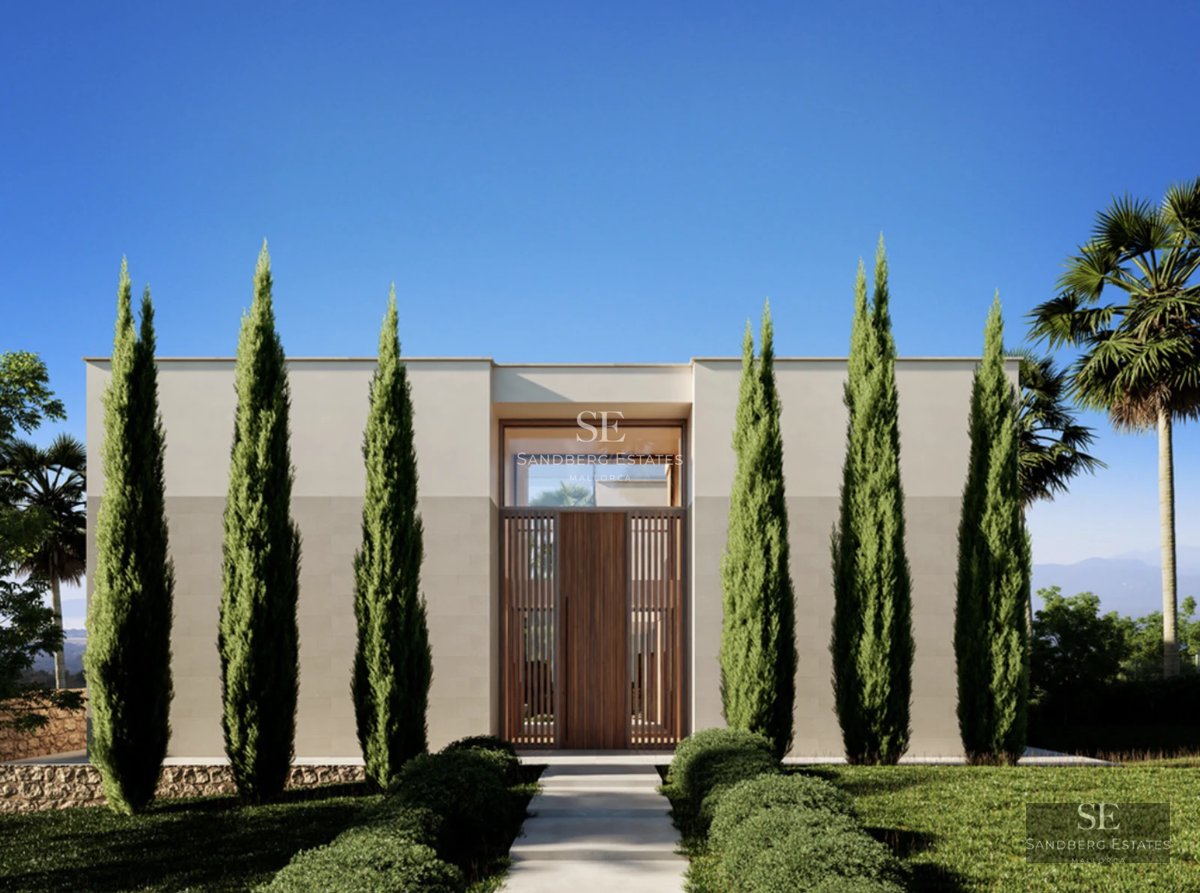 View of a designer pool with steps, surrounded by greenery and a modern house with large windows. A luxurious outdoor space.