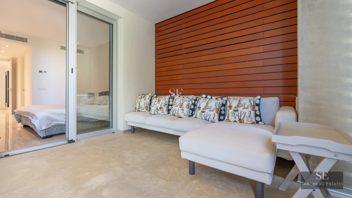 Expansive terrace with infinity pool. Modern design featuring sleek outdoor furniture and panoramic sea views. Luxury and comfort.