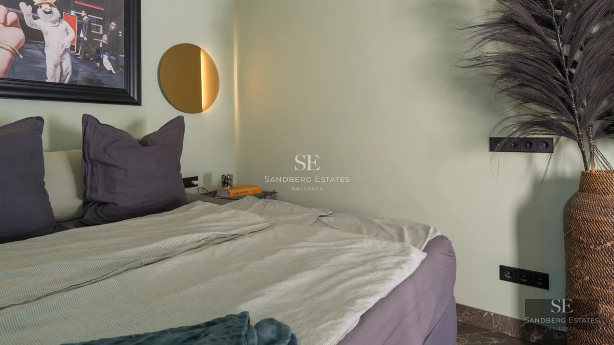 Large swimming pool with sun deck, surrounded by greenery. Modern architecture with large windows and terrace. Ideal for outdoor living.