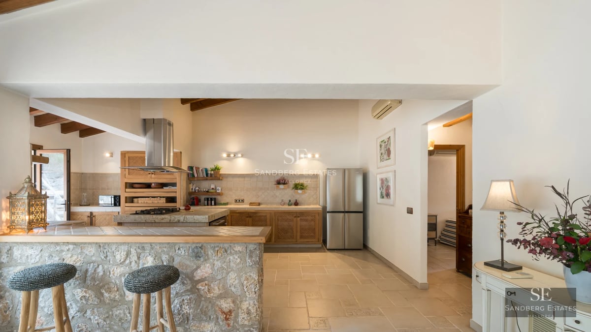 Exterior view of a modern villa featuring an infinity pool, lush garden, and minimalist architecture. Large windows and sunny terraces.