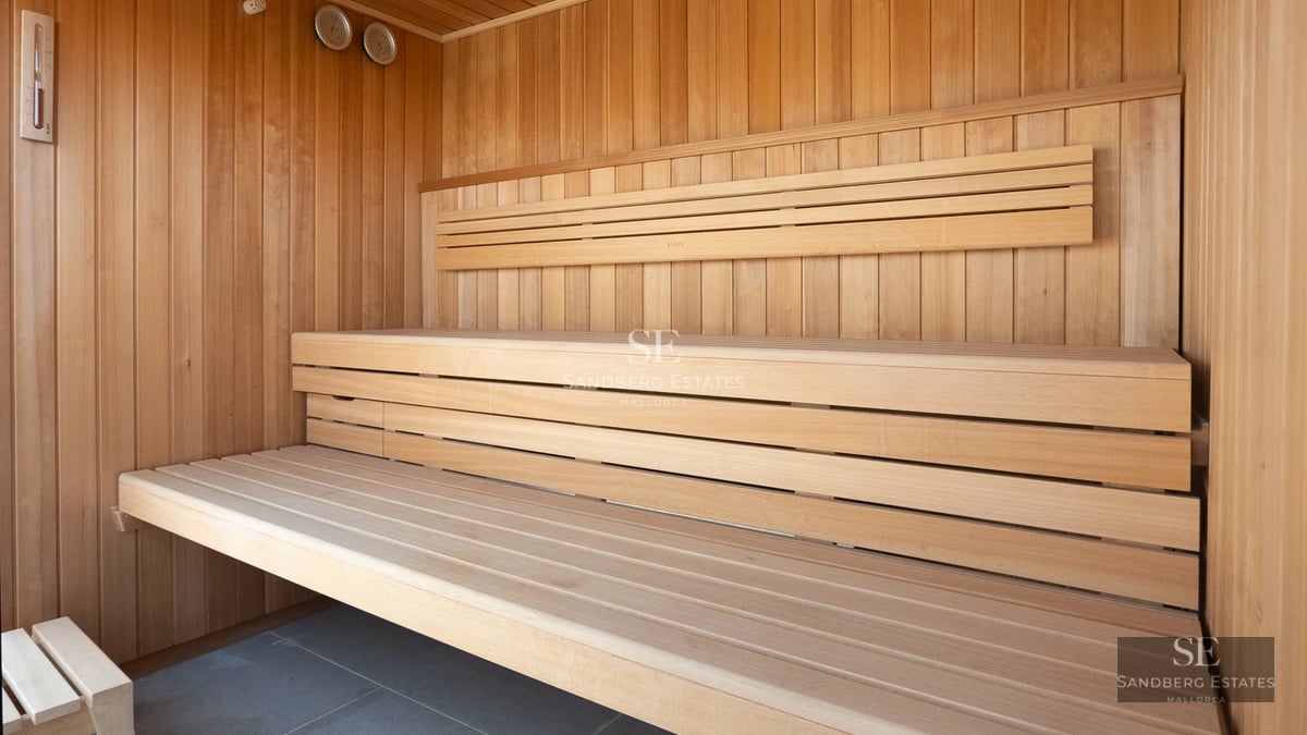 Exterior view of modern villa with pool, garden, and large windows. Minimalist architecture. Clear sky.