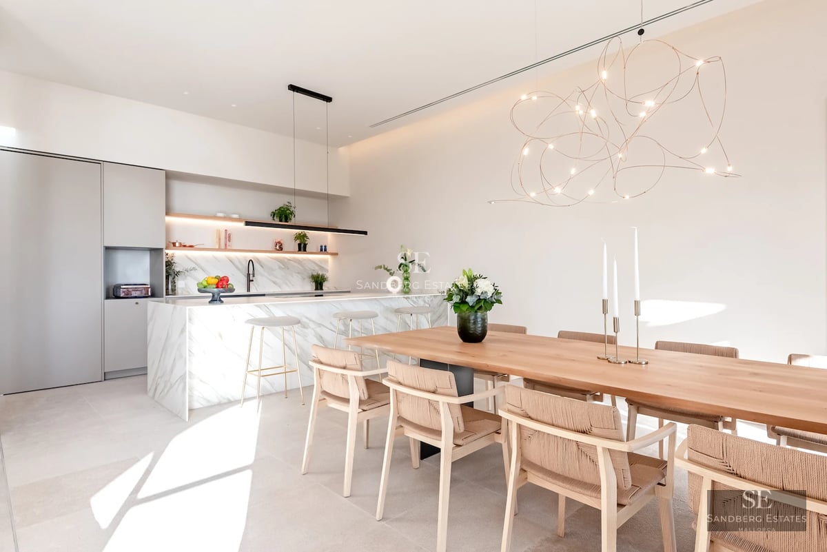Exterior view of a modern villa with pool. Minimalist architecture, large windows, blue pool, and lush garden.
